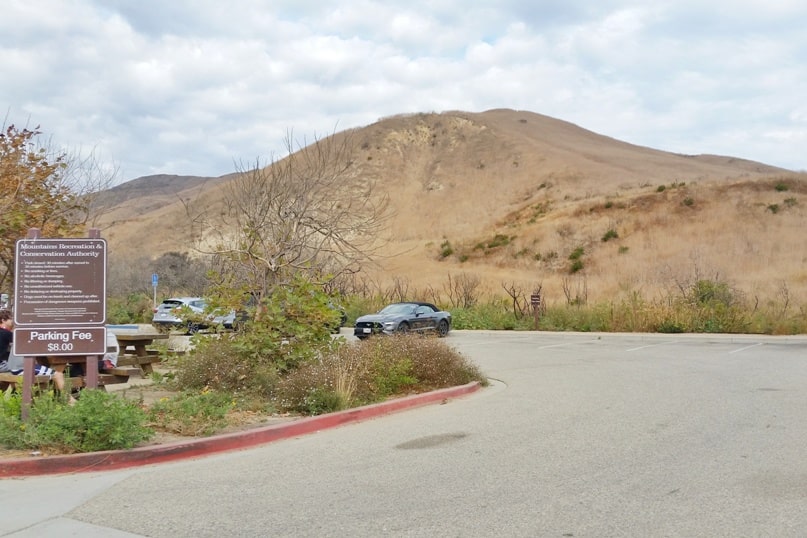One day trip to Malibu without a car. Best things to do in Malibu in one day itinerary - corral canyon hike trailhead start parking lot. from Los Angeles LA Santa Monica. California travel blog