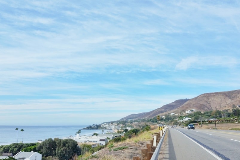 One day trip to Malibu without a car. Best things to do in Malibu in one day itinerary - walk Pacific Coast Highway PCH to Malibu sign. from Los Angeles LA Santa Monica. California travel blog