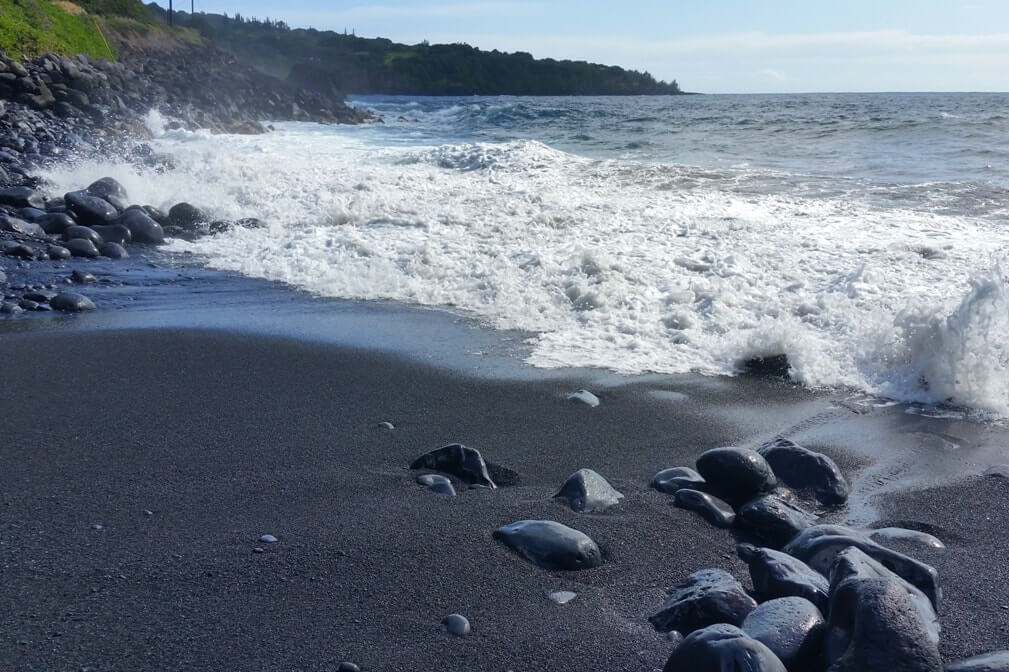 Black sand beach in Maui Hawaii: beach near alelele bridge. Maui Hawaii travel blog