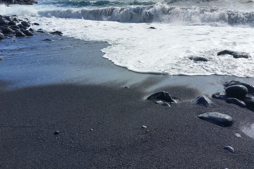 Black sand beach in Maui Hawaii: beach near alelele bridge. Maui Hawaii travel blog