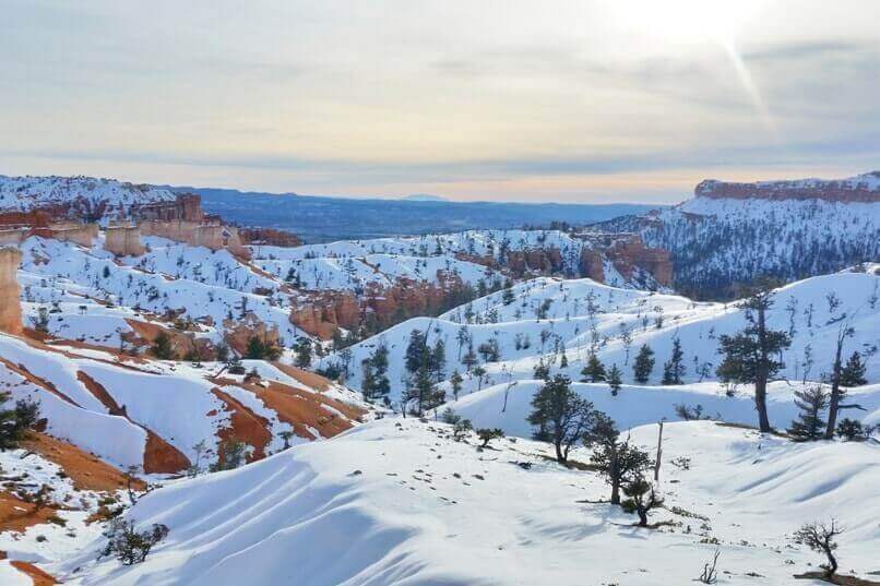 best national parks in winter: snow in national parks in October, November, December, January, February, March, April. Arizona Utah road trip national park travel blog