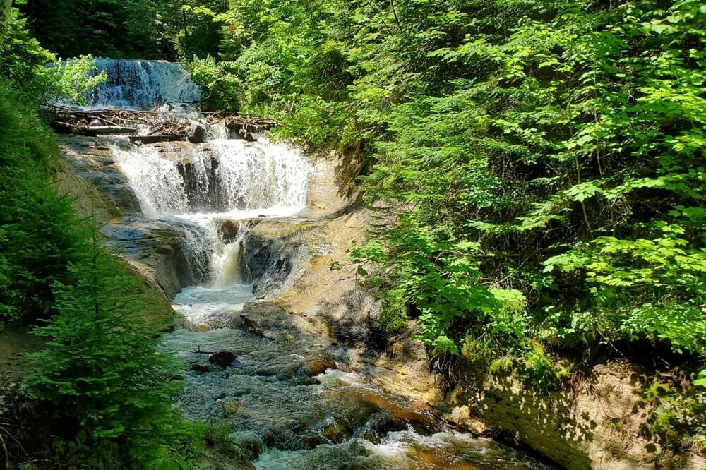 Sable Falls waterfalls. Best things to do in Pictured Rocks National Lakeshore from Grand Marais. Best waterfalls in Upper Peninsula. UP Michigan travel blog