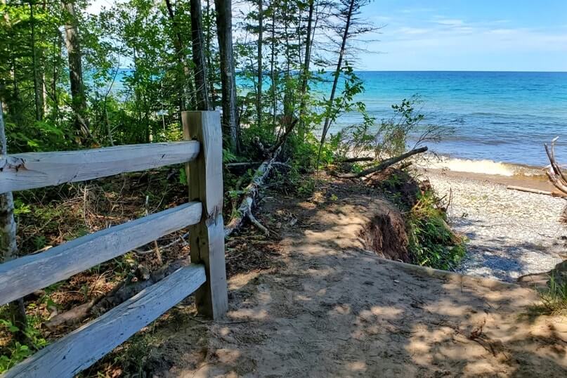 Sable Falls Trail to beach. forest waterfall beach hike in Pictured Rocks. UP Michigan travel blog