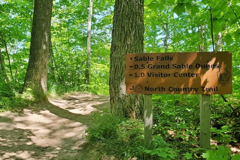 Sable Falls Trail hiking to waterfalls. forest waterfall hike in Pictured Rocks. UP Michigan travel blog