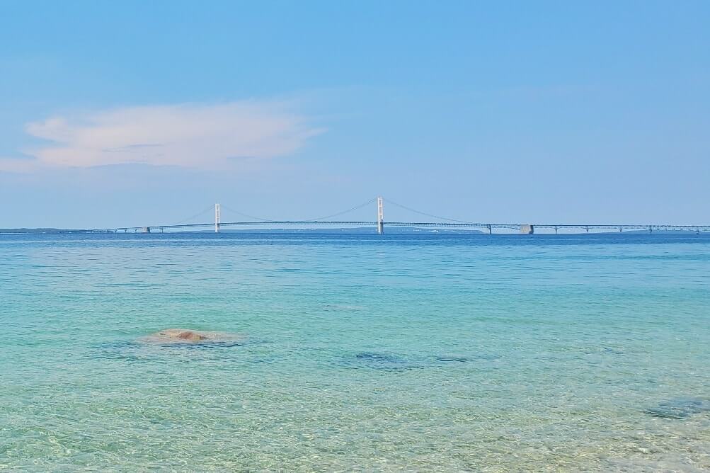 Best places to visit in Michigan on the drive to the Upper Peninsula with Mackinac Bridge views. Michigan travel blog