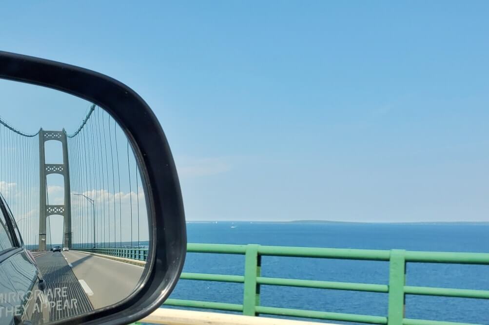 Best places to visit in the UP upper peninsula Michigan. Driving across mackinac bridge. Michigan travel blog