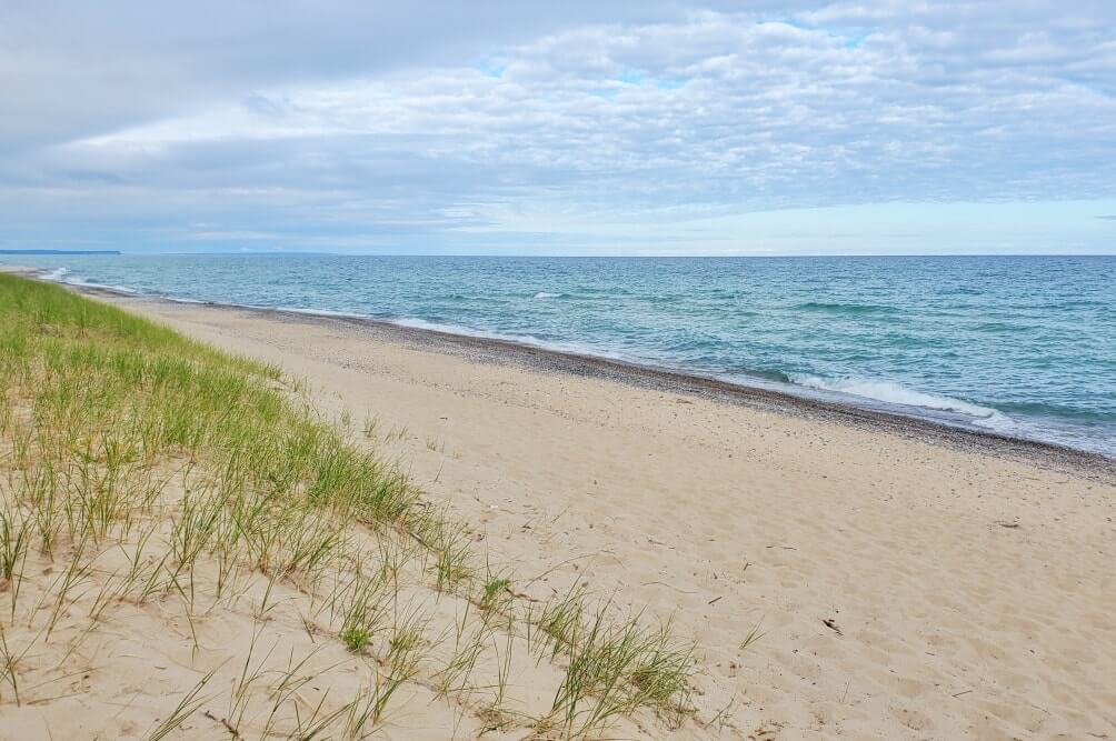 Best places to visit in the UP upper peninsula Michigan: Pictured Rocks National Lakeshore beach. Michigan travel blog