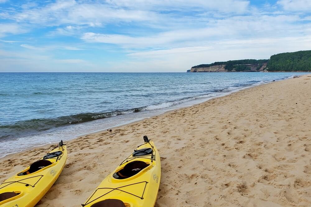 Best places to visit in the UP upper peninsula Michigan: Pictured Rocks National Lakeshore kayak tour. Michigan travel blog