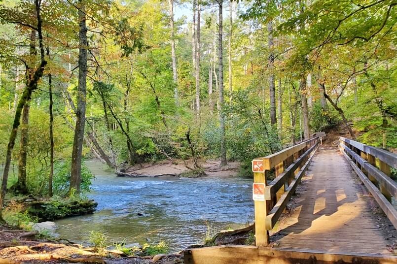 The start of Abrams Falls hiking trail: Best Cades Cove hike in Smoky Mountains. bridge river crossing, great scenic views in Tennessee TN. Smokies travel blog