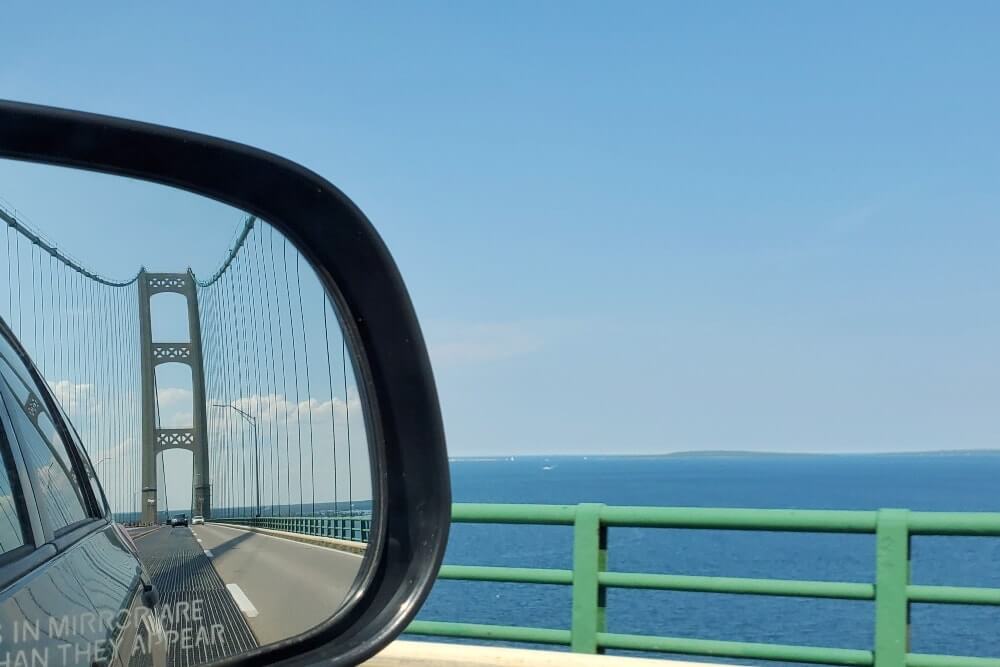 Getting to Castle Rock in St Ignace, Michigan: Driving across Mackinac Bridge. up michigan travel blog