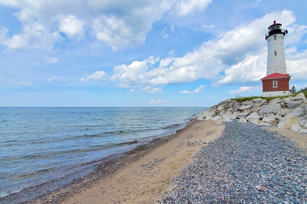 Crisp Point Lighthouse: Best Lake Superior beaches to visit in Upper Peninsula, near Crisp Point lighthouse. Best Michigan beaches. UP michigan travel blog