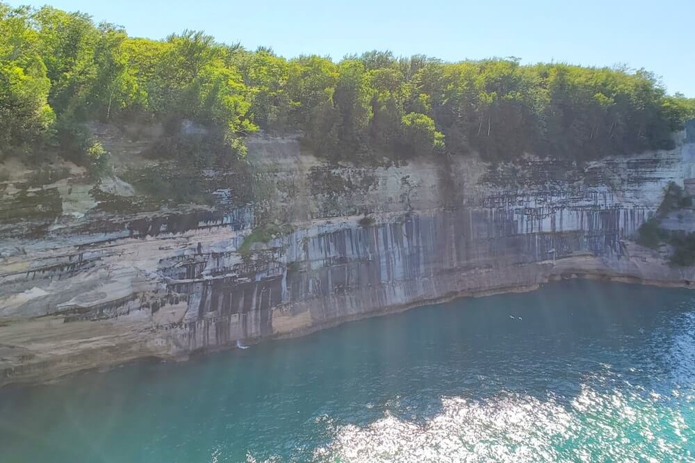 Things to do in Pictured Rocks National Lakeshore park: hike the chapel loop trail where to see pictured rocks cliffs by hiking. UP Michigan travel blog