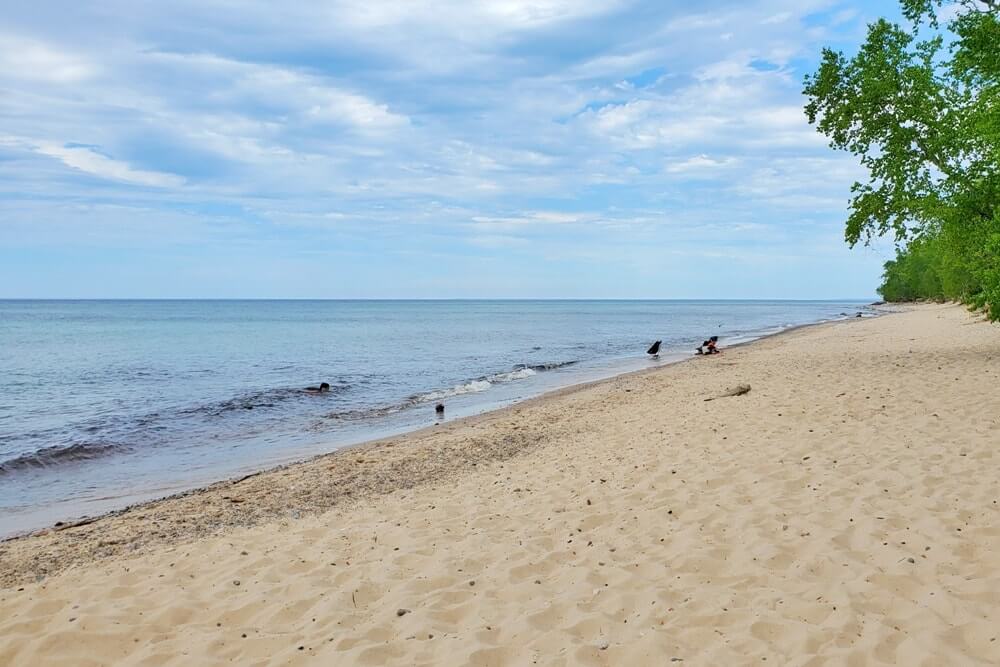 Things to do in Pictured Rocks National Lakeshore park: hurricane river, beach. where to see river flow into lake superior. UP Michigan travel blog