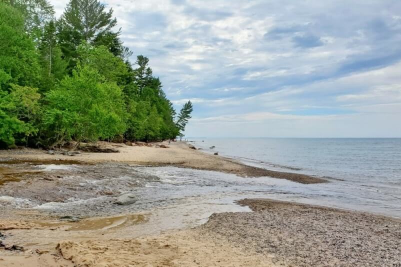 Things to do in Pictured Rocks National Lakeshore park: hurricane river, beach. where to see river flow into lake superior. UP Michigan travel blog