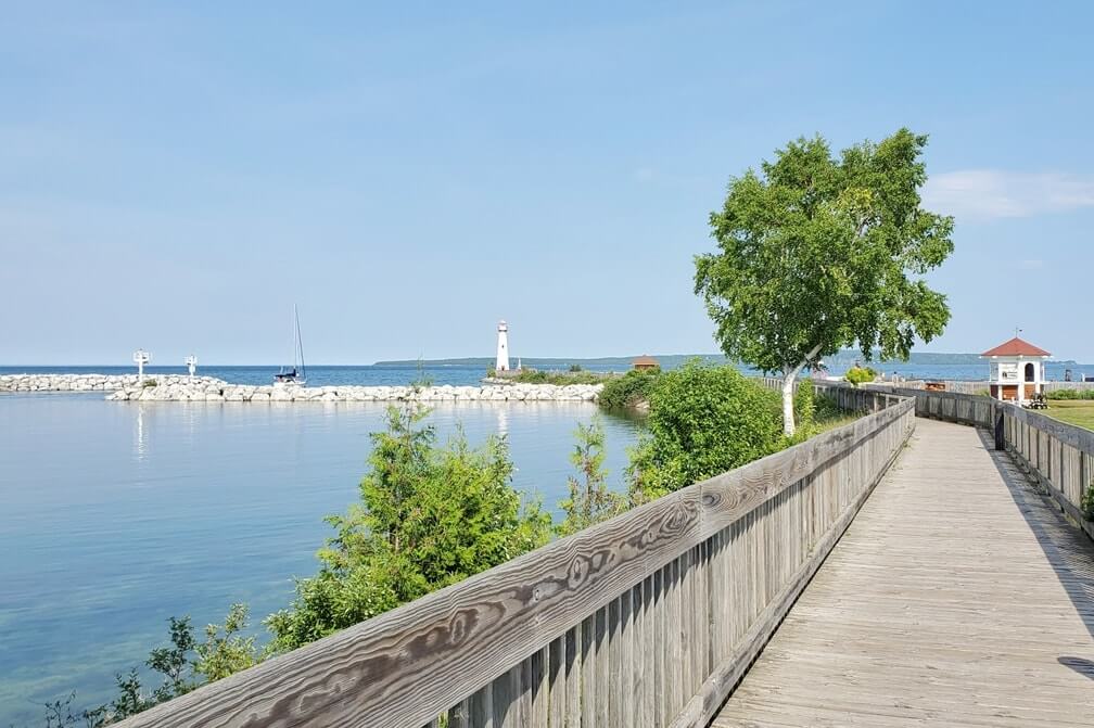 Huron Boardwalk Trail in St Ignace MI: Walking to wawatam lighthouse pier. up michigan travel blog