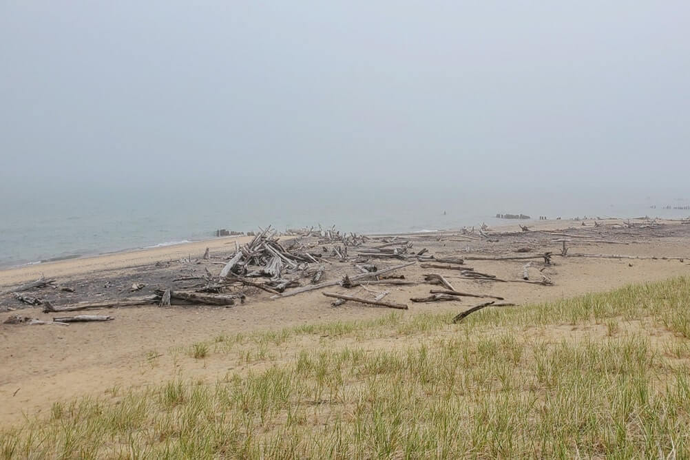 Whitefish Point beach sand dunes near whitefish point lighthouse. Lake Superior lighthouse shipwreck coast. upper peninsula. up michigan travel blog