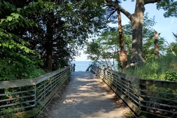 Path to Lake Michigan overlook. Muskegon State Park camping, Lake Michigan campground, path to campers beach at Lake Michigan. michigan travel blog