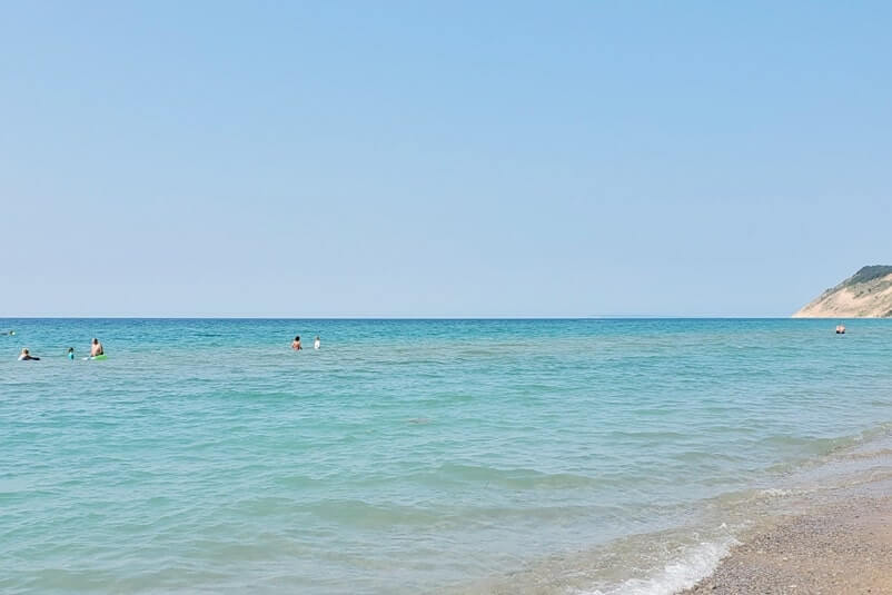 Things to do in Sleeping Bear Dunes: Lake Michigan swimming beach. michigan travel blog