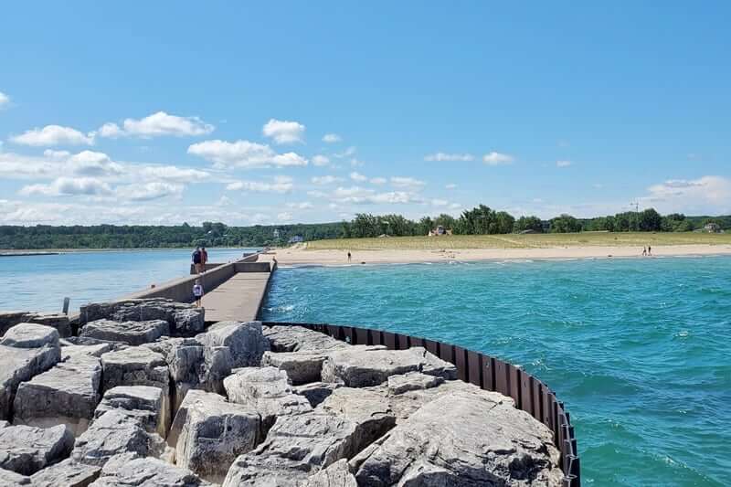 Grand Marais lighthouse pier walk. Lake Superior lighthouse pier. Grand Marais MI. grand marais harbor of refuge outer lighthouse. up michigan travel blog