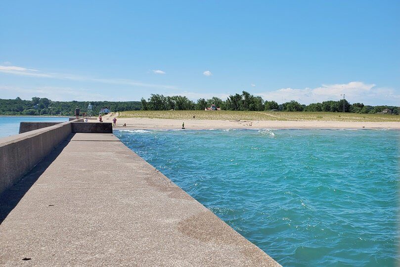 Grand Marais lighthouse pier walk. Lake Superior lighthouse pier. Grand Marais MI. grand marais harbor of refuge outer lighthouse. up michigan travel blog