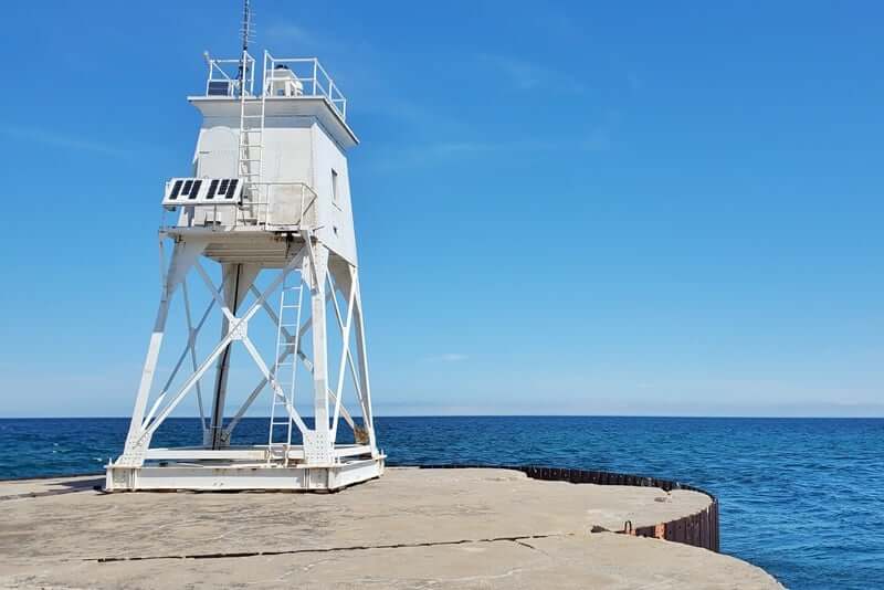 Grand Marais lighthouse pier walk. Lake Superior lighthouse pier. Grand Marais MI. grand marais harbor of refuge outer lighthouse. up michigan travel blog