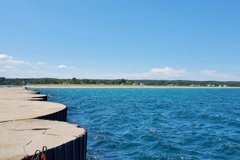 Grand Marais lighthouse pier walk. Lake Superior lighthouse pier. Grand Marais MI. grand marais harbor of refuge outer lighthouse. up michigan travel blog