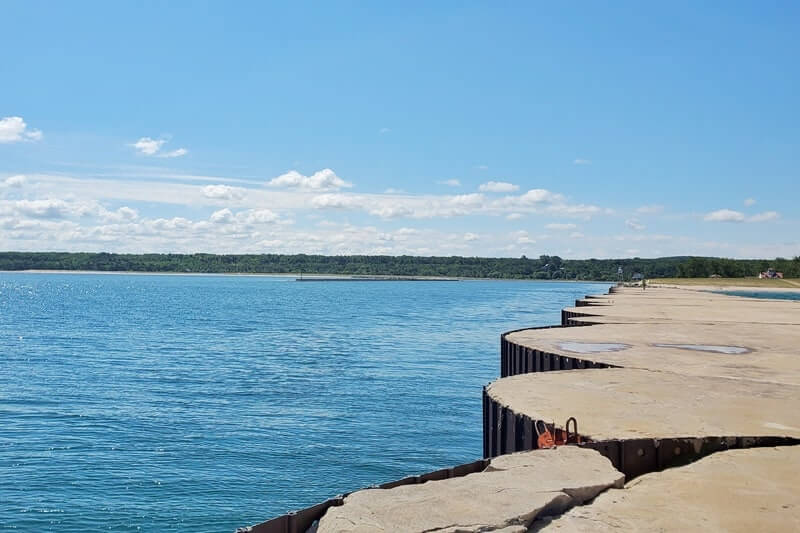 Grand Marais lighthouse pier walk. Lake Superior lighthouse pier. Grand Marais MI. grand marais harbor of refuge outer lighthouse. up michigan travel blog