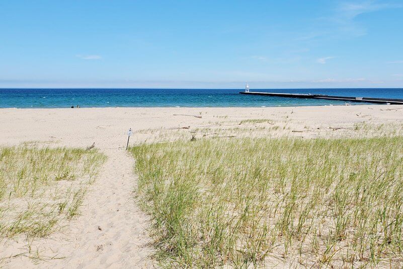 Sand dunes in Grand Marais MI. grand sable dunes. lake superior sand dunes. Getting to Grand Marais lighthouse pier. getting to grand marais harbor of refuge outer lighthouse pier. lake superior. grand marais MI lighthouses. up michigan travel blog