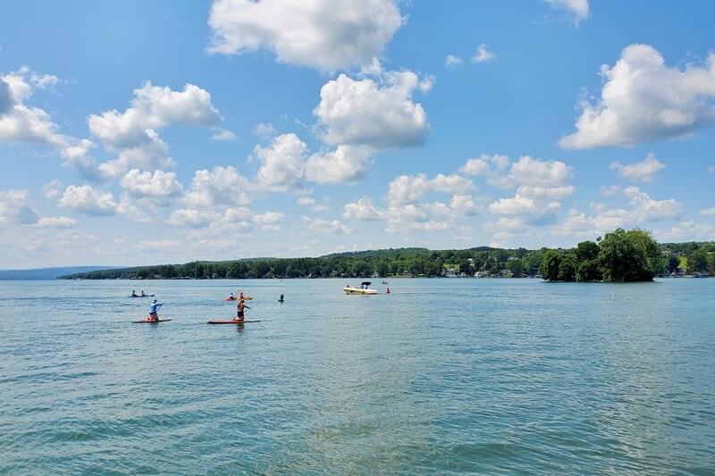 Canandaigua Lake. Things to do in Canandaigua NY: stand up paddleboarding, sup, kayaking squaw island state park. finger lakes new york travel blog