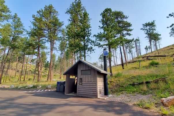 Jewel Cave bathroom in historic area near natural entrance. south dakota travel blog