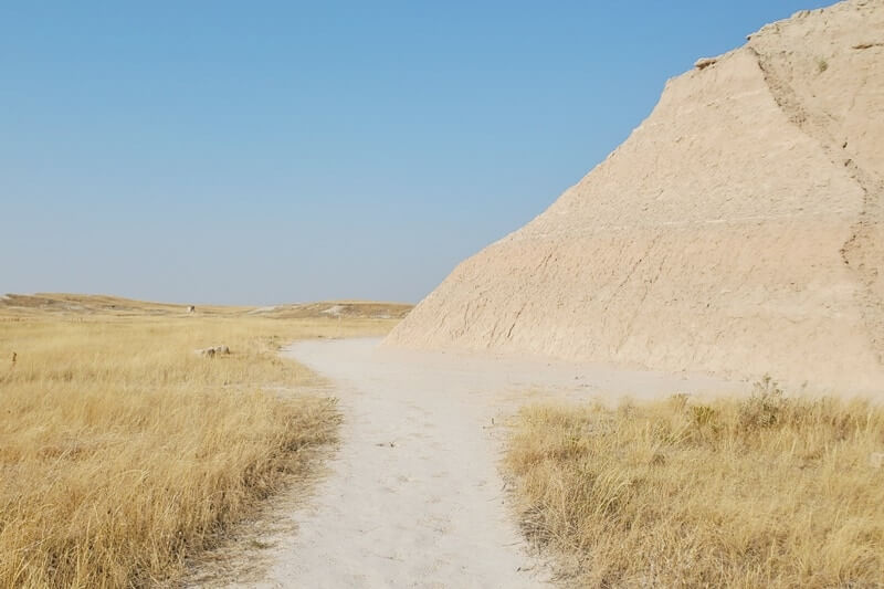 Where to start hiking the castle trail from old northeast road parking to door window notch. badlands national park. south dakota travel blog