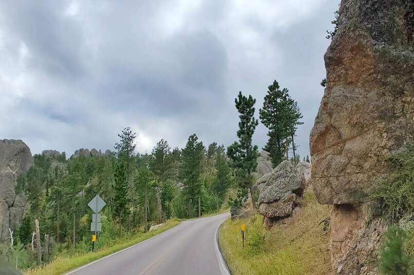 Driving to Little Devils Tower Trailhead parking along Needles Highway. custer state park. south dakota travel blog