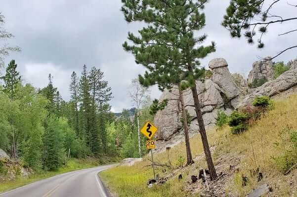 Driving to Little Devils Tower Trailhead parking along Needles Highway. custer state park. south dakota travel blog