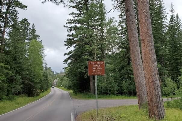Driving to Little Devils Tower Trailhead parking along Needles Highway. road to little devils tower trailhead. custer state park. south dakota travel blog