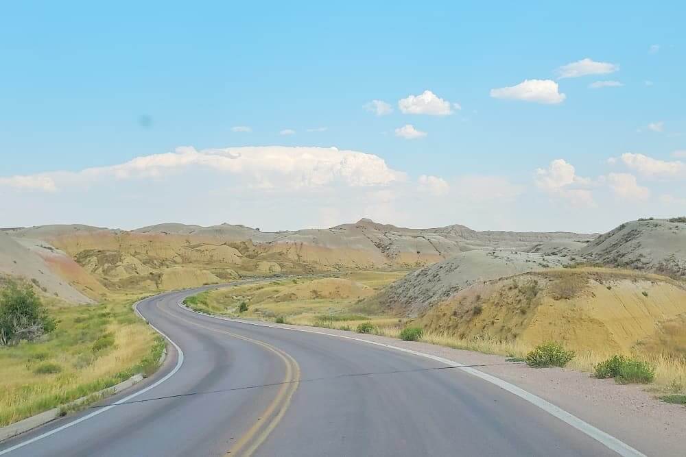 Where to see yellow badlands in South Dakota: Scenic drive along Badlands Loop Road in Badlands National Park. sd travel blog