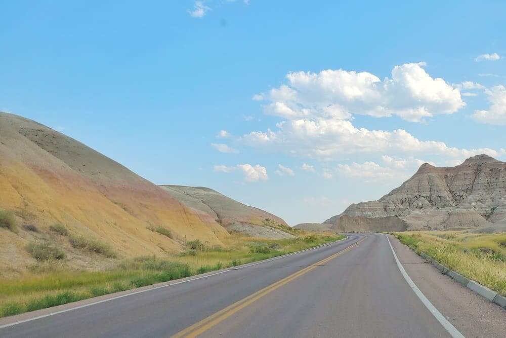 Where to see yellow badlands in South Dakota: Scenic drive along Badlands Loop Road in Badlands National Park. sd travel blog