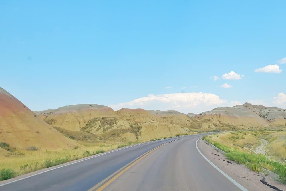 Where to see yellow badlands in South Dakota: Scenic drive along Badlands Loop Road in Badlands National Park. sd travel blog