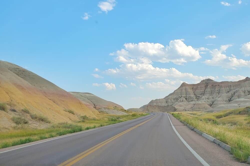 Where to see yellow badlands in South Dakota: Scenic drive along Badlands Loop Road in Badlands National Park. sd travel blog
