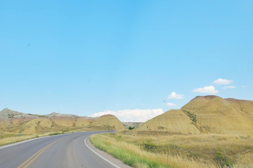 Where to see yellow badlands in South Dakota: Scenic drive along Badlands Loop Road in Badlands National Park. sd travel blog