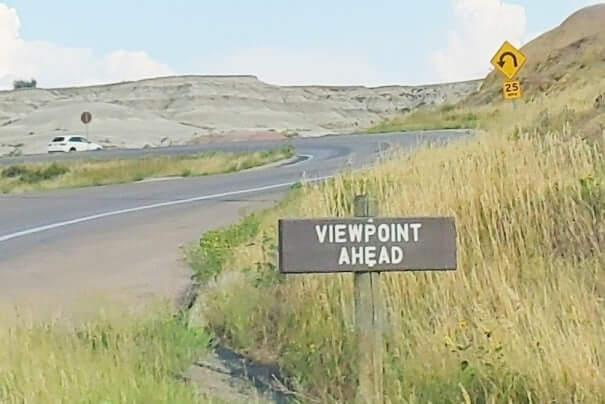 Driving Badlands Loop Road see yellow badlands. driving to yellow mounds overlook in Badlands National Park. sd travel blog