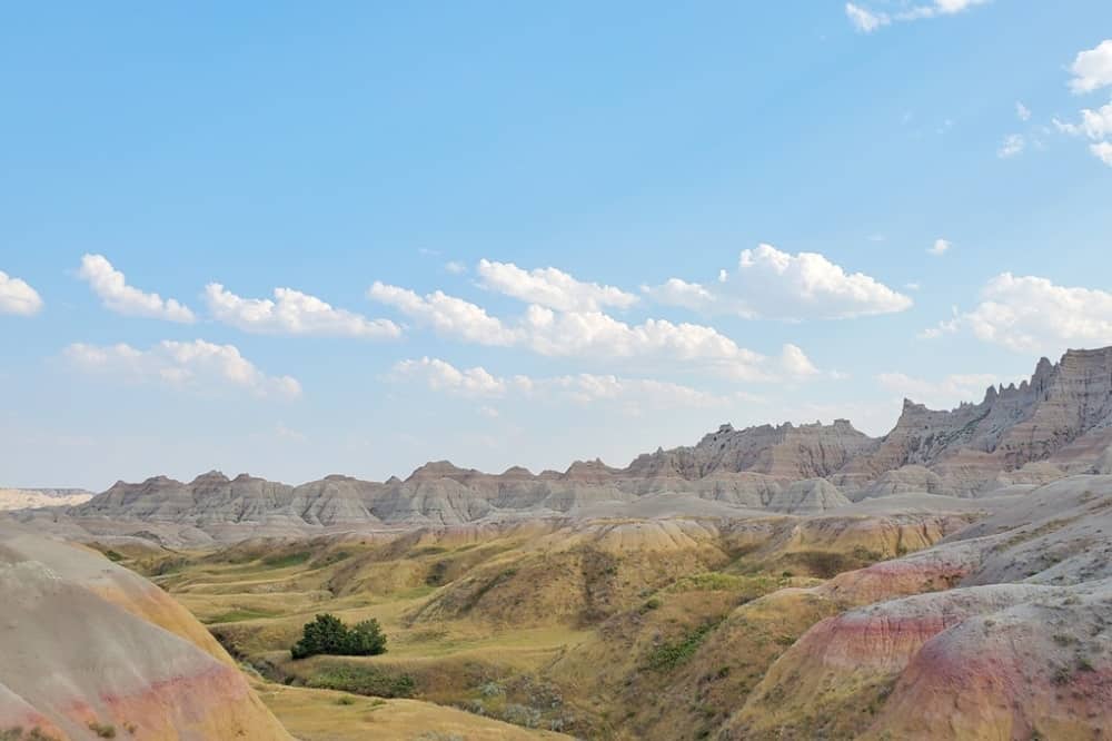 Where to see yellow badlands in South Dakota: Scenic drive along Badlands Loop Road in Badlands National Park. sd travel blog