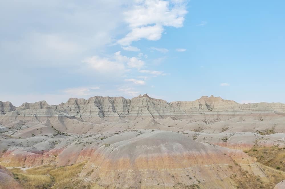 Where to see yellow badlands in South Dakota: Scenic drive along Badlands Loop Road in Badlands National Park. sd travel blog