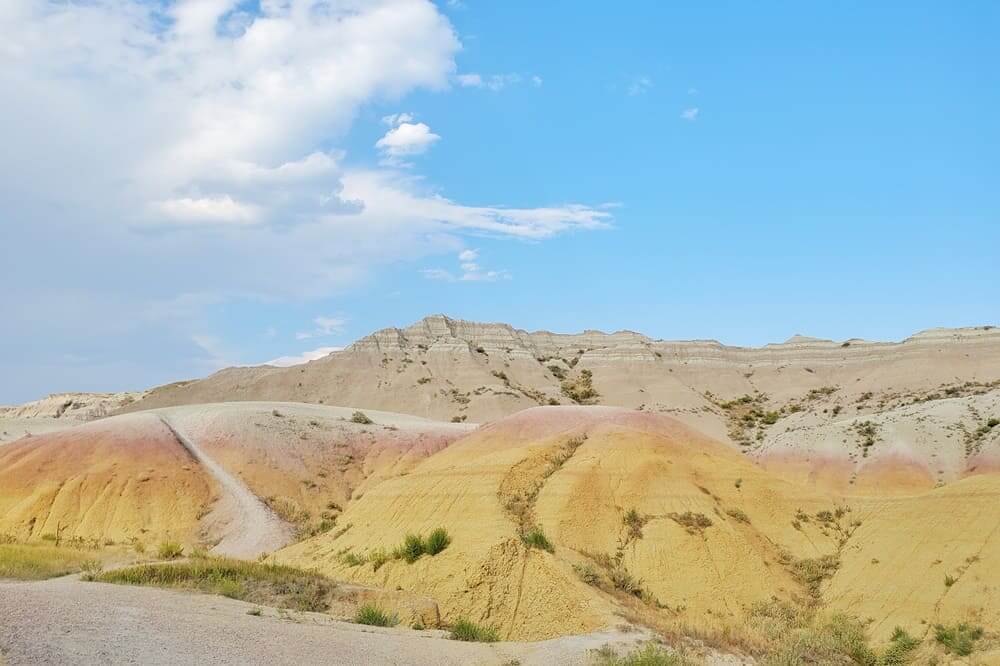 Hiking from Yellow Mounds Overlook. yellow mounds trail. Badlands National Park. sd travel blog
