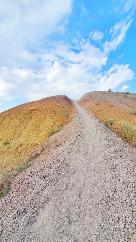 Hiking from Yellow Mounds Overlook. yellow mounds trail. Badlands National Park. sd travel blog