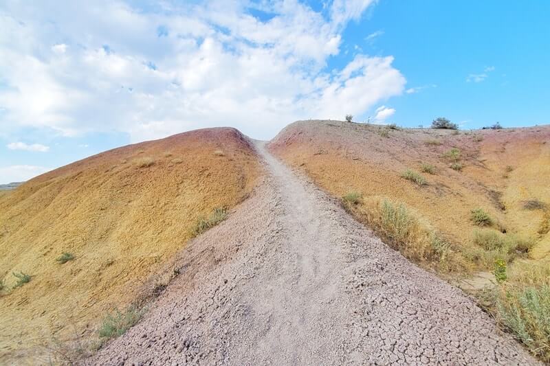 Hiking from Yellow Mounds Overlook. yellow mounds trail. Badlands National Park. sd travel blog
