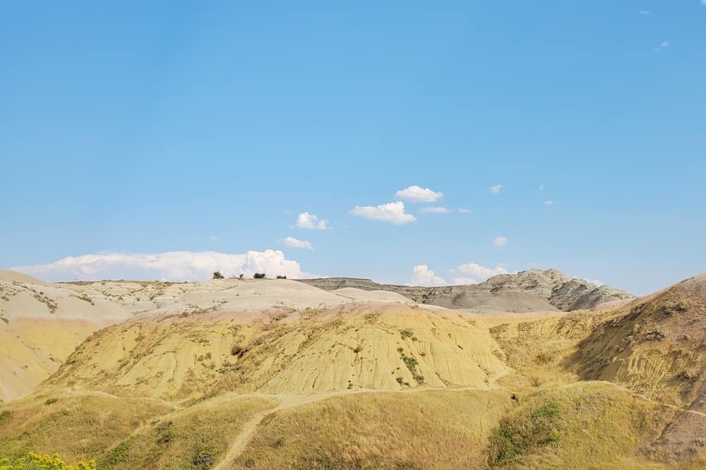 Yellow Mounds overlook: scenic views of yellow badlands in badlands national park. south dakota travel blog