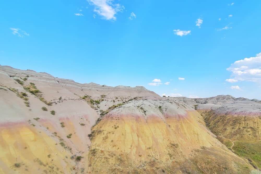 Where to see yellow badlands in South Dakota: Yellow Mounds Overlook scenic viewpoint in Badlands National Park. sd travel blog
