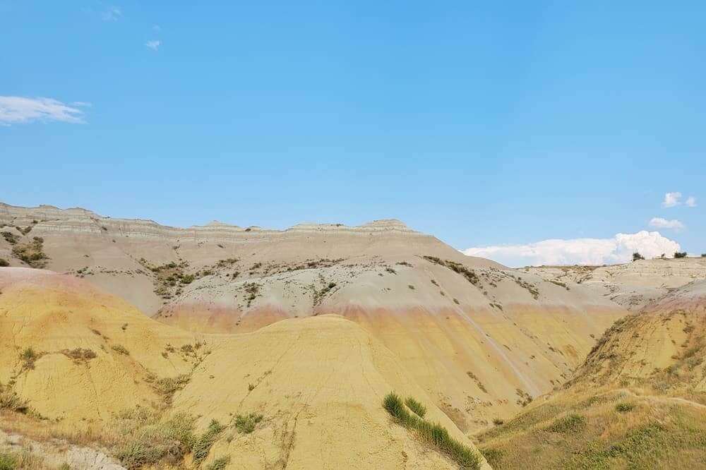 Where to see yellow badlands in South Dakota: Yellow Mounds Overlook scenic viewpoint in Badlands National Park. sd travel blog
