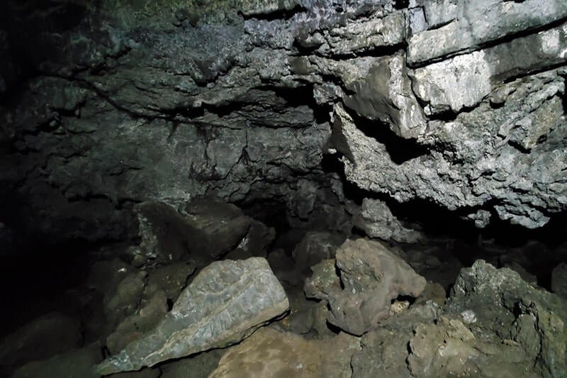 walking through beauty cave lava tube. craters of the moon. idaho travel blog