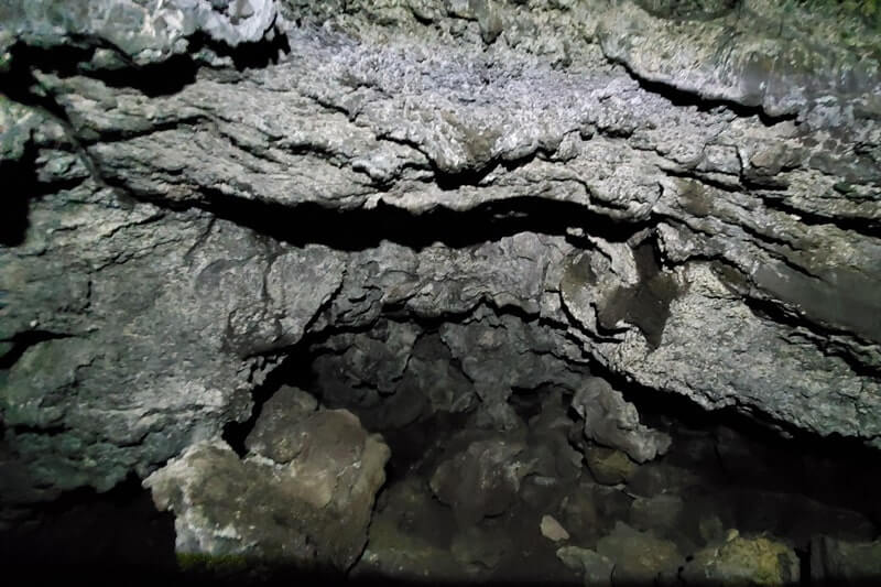 walking through beauty cave lava tube. craters of the moon. idaho travel blog